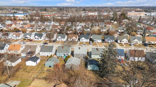 birds eye view of property with a residential view