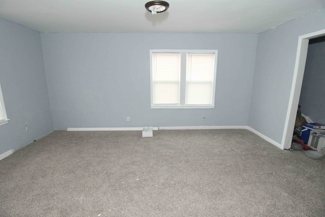 unfurnished bedroom featuring carpet flooring and baseboards