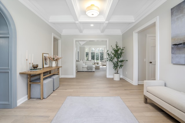 corridor with beam ceiling, coffered ceiling, light wood finished floors, and ornamental molding