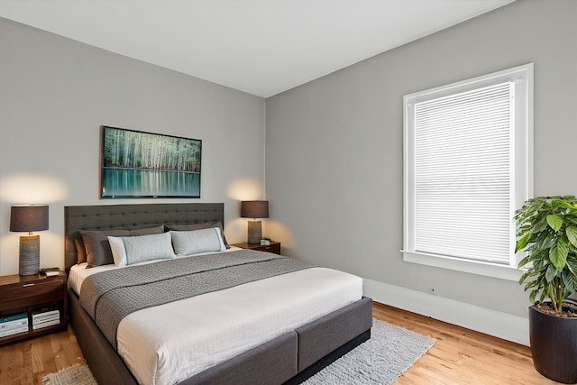 bedroom with wood finished floors