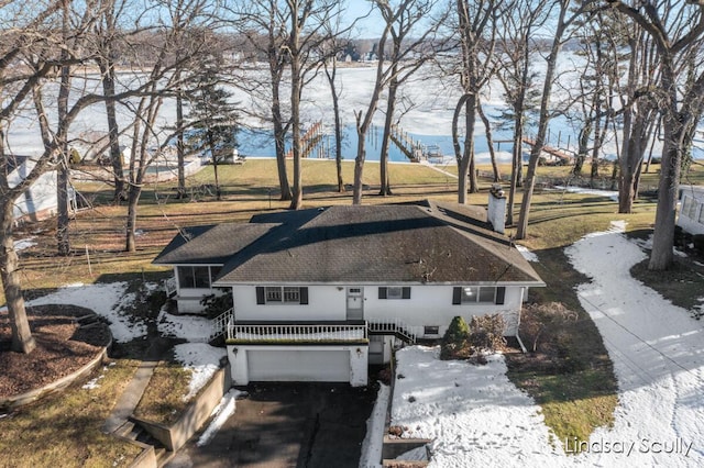 view of front of property with an attached garage, driveway, and stucco siding