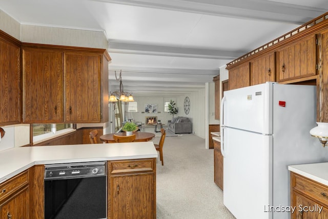 kitchen with light colored carpet, black dishwasher, open floor plan, beam ceiling, and freestanding refrigerator