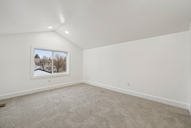 bonus room featuring lofted ceiling, recessed lighting, carpet flooring, visible vents, and baseboards