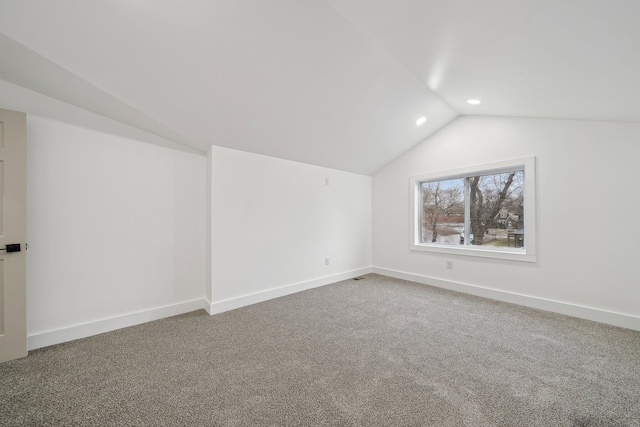 additional living space featuring vaulted ceiling, carpet floors, recessed lighting, and baseboards