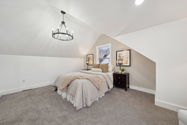 carpeted bedroom with lofted ceiling, a chandelier, and baseboards