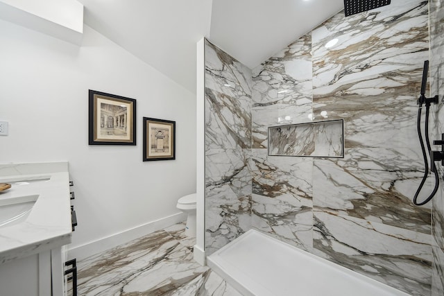 full bath featuring double vanity, marble finish floor, a marble finish shower, and toilet