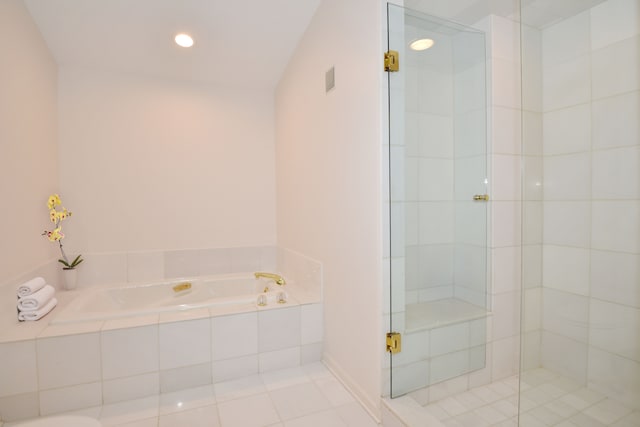 bathroom with tile patterned floors, recessed lighting, a garden tub, and a shower stall