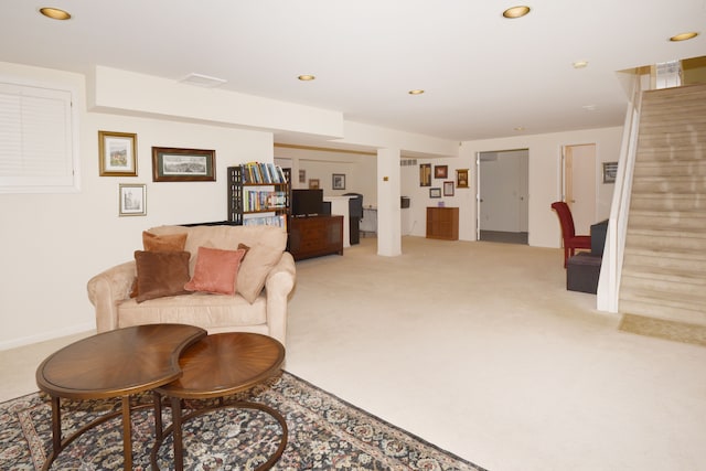 living area featuring stairway, recessed lighting, visible vents, and light colored carpet