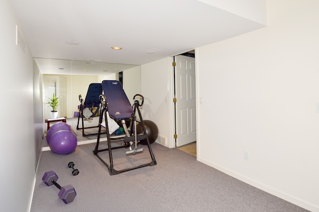 exercise area with recessed lighting, visible vents, and baseboards