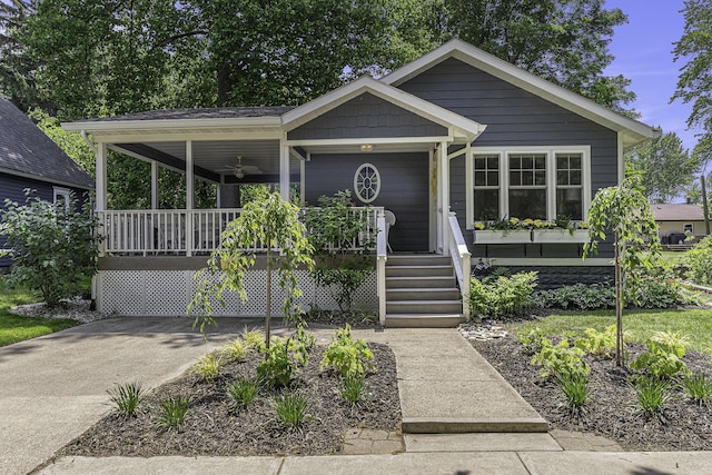 view of front of home with a porch and concrete driveway