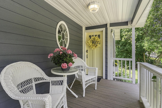 wooden terrace with a porch