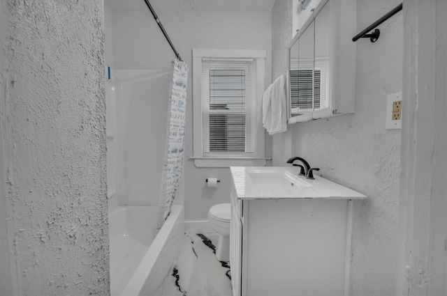 bathroom with a textured wall, toilet, vanity, marble finish floor, and shower / bath combo