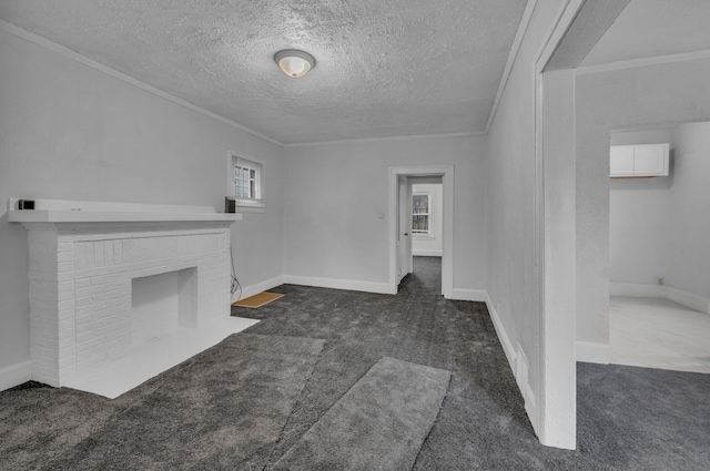 unfurnished living room with a fireplace, dark carpet, a textured ceiling, and ornamental molding