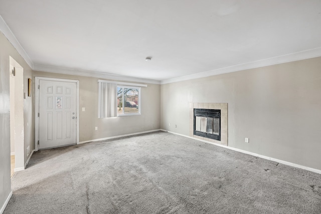 unfurnished living room with crown molding, a fireplace, carpet flooring, and baseboards