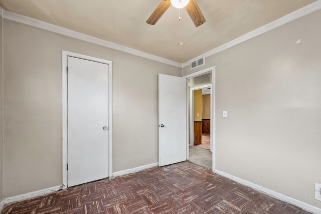 unfurnished bedroom featuring ornamental molding, visible vents, baseboards, and a ceiling fan