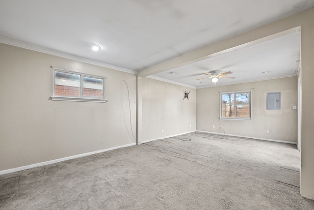 carpeted empty room with baseboards, electric panel, ornamental molding, and ceiling fan