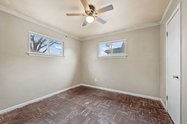 unfurnished bedroom featuring dark floors, ornamental molding, multiple windows, and baseboards