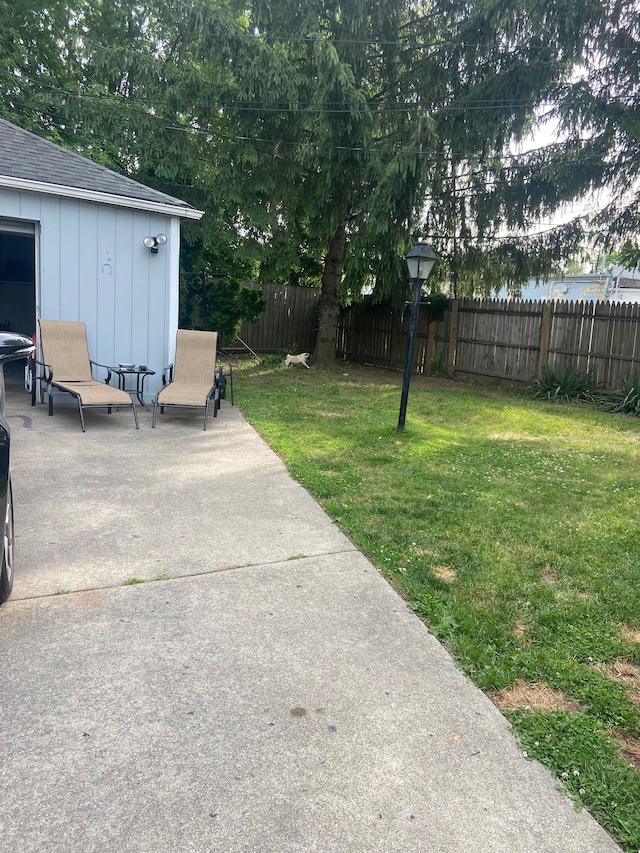 view of yard featuring fence private yard and a patio area