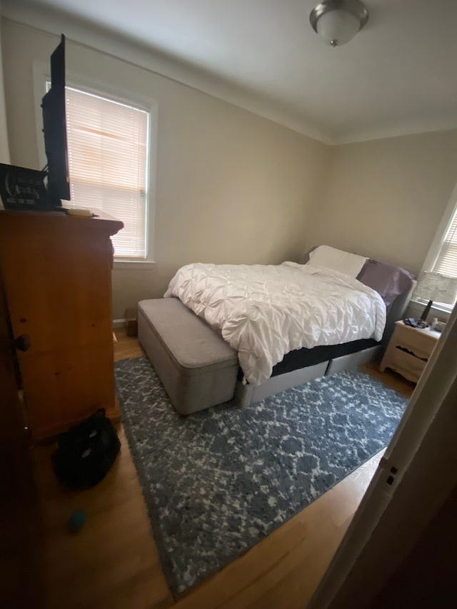 bedroom with wood finished floors