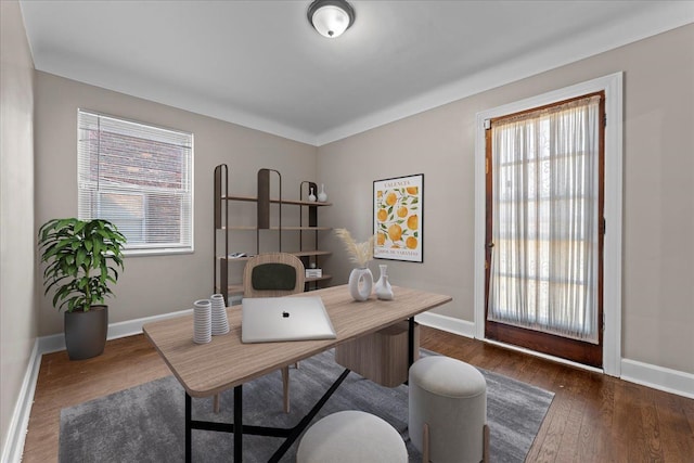 office area featuring dark wood-type flooring and baseboards