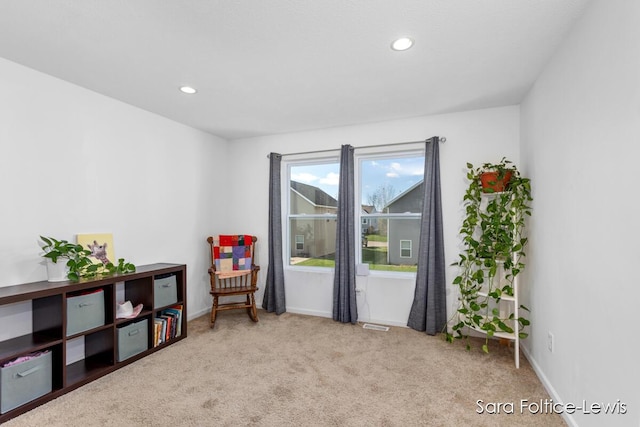 sitting room featuring carpet, baseboards, and recessed lighting