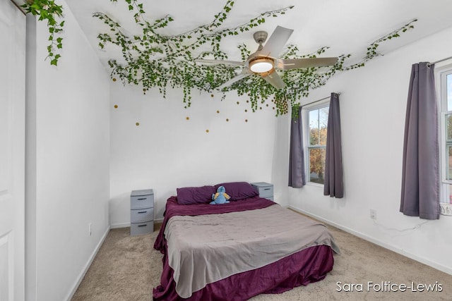 carpeted bedroom with baseboards