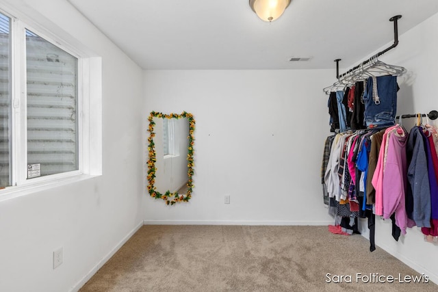 walk in closet with carpet flooring and visible vents