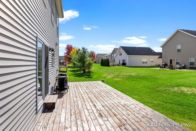 deck featuring a lawn