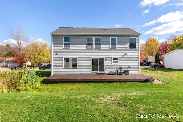 back of property with a lawn and a wooden deck