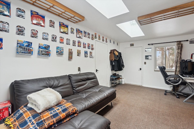 carpeted living room featuring a skylight and baseboards