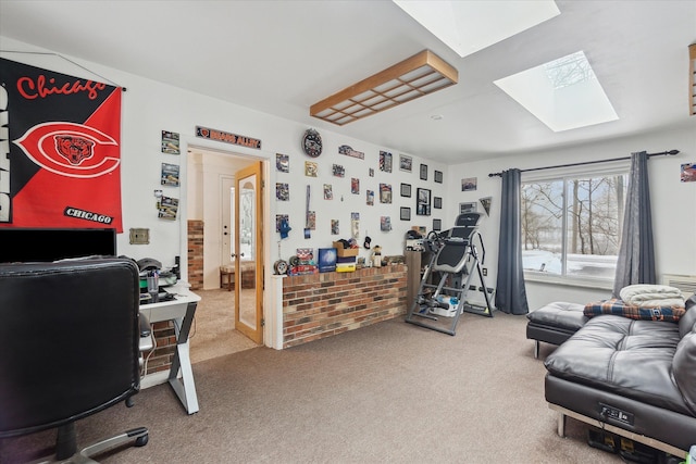 office area featuring a skylight and carpet flooring