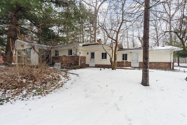 view of front of property featuring brick siding