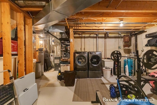 unfinished below grade area with washer and clothes dryer