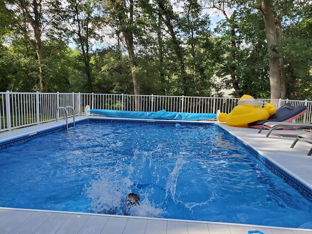 view of pool with a fenced in pool