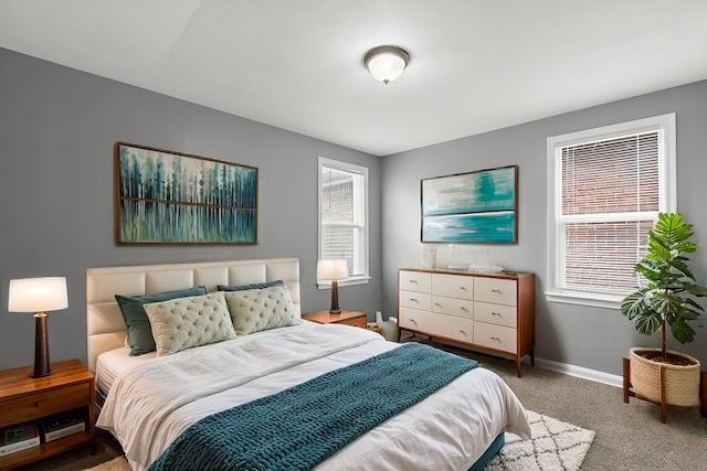 carpeted bedroom with baseboards