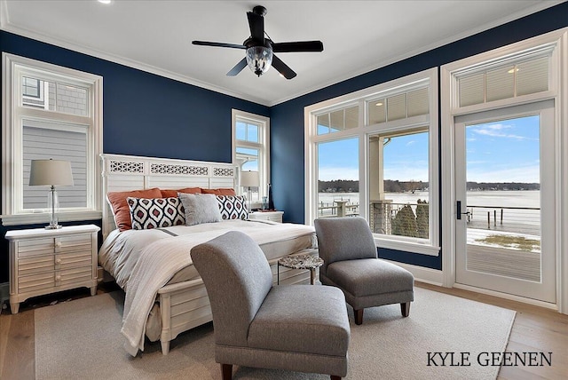bedroom with ornamental molding, access to outside, light wood finished floors, and a ceiling fan