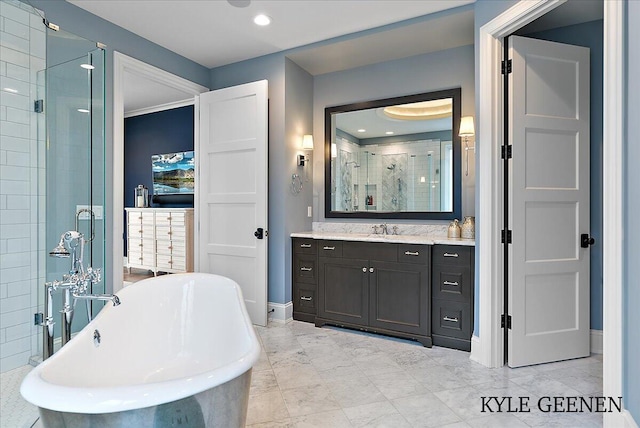 full bathroom featuring recessed lighting, a soaking tub, a stall shower, vanity, and baseboards