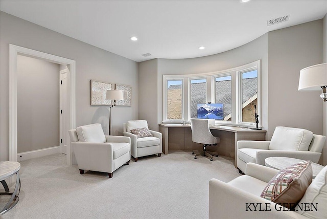 office featuring recessed lighting, visible vents, baseboards, and light colored carpet