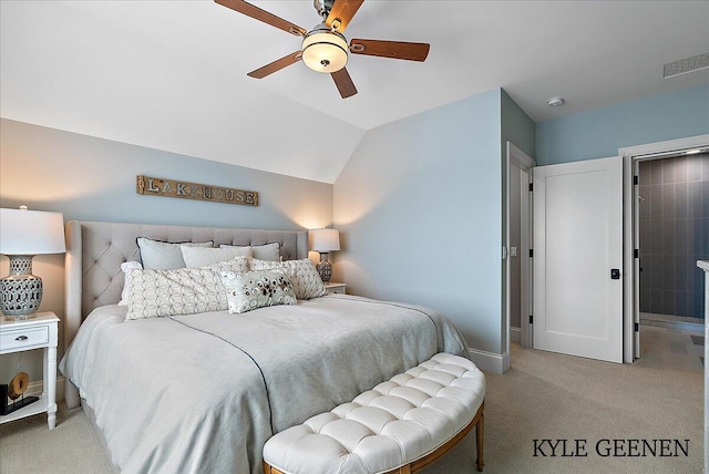 carpeted bedroom featuring vaulted ceiling, baseboards, visible vents, and a ceiling fan