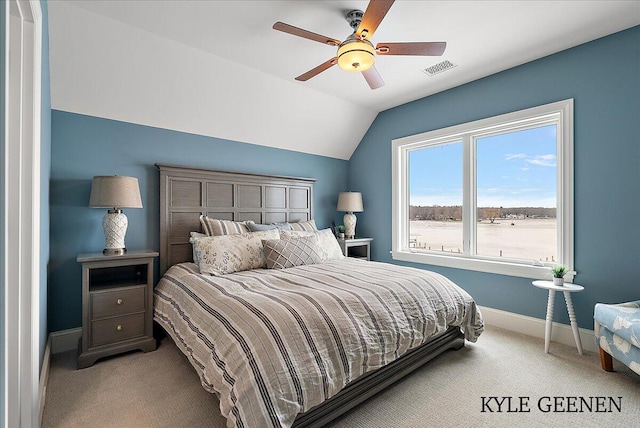 carpeted bedroom with a ceiling fan, visible vents, vaulted ceiling, and baseboards