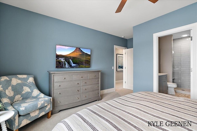 bedroom featuring baseboards, ceiling fan, connected bathroom, and light colored carpet