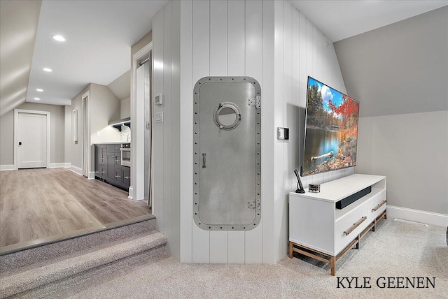 bathroom featuring vaulted ceiling, baseboards, and recessed lighting