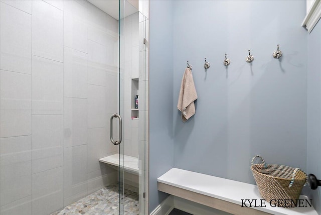 bathroom with a shower stall