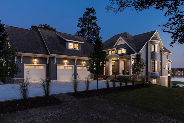 view of front of home featuring concrete driveway and a front lawn