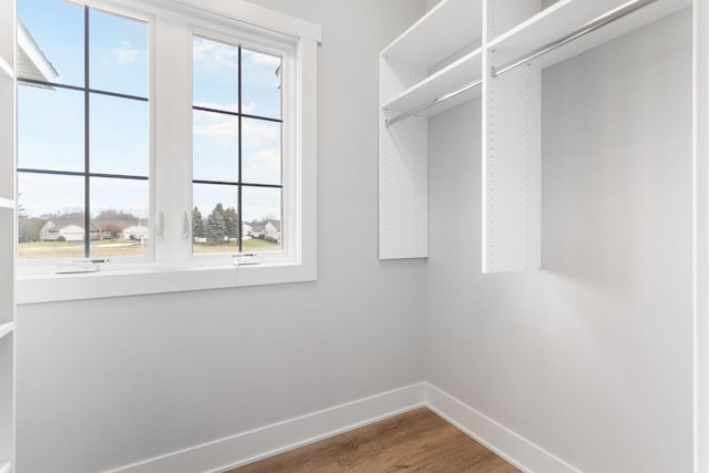 spacious closet with wood finished floors