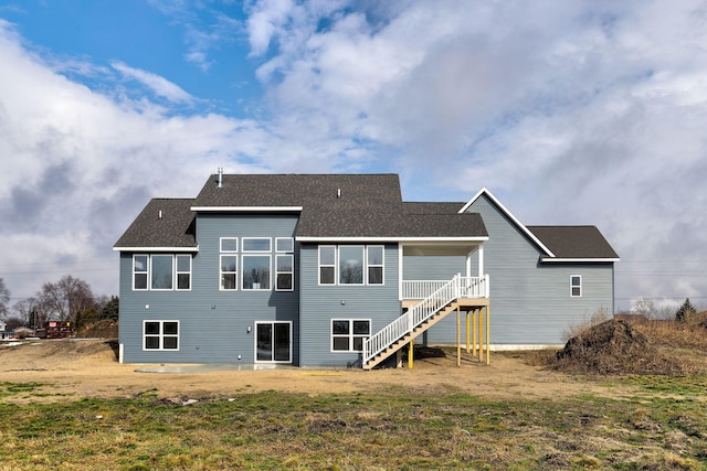 back of house with stairs, a yard, roof with shingles, and a wooden deck