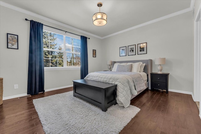 bedroom with baseboards, dark wood finished floors, visible vents, and crown molding