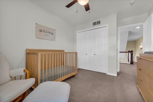 bedroom with carpet floors, a closet, visible vents, ceiling fan, and baseboards