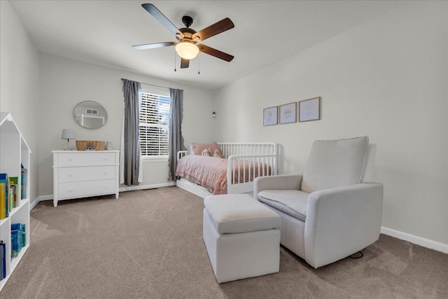 carpeted bedroom featuring ceiling fan and baseboards