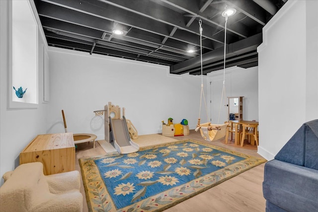 recreation room featuring visible vents and wood finished floors